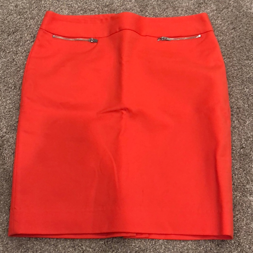 Bright orange skirt